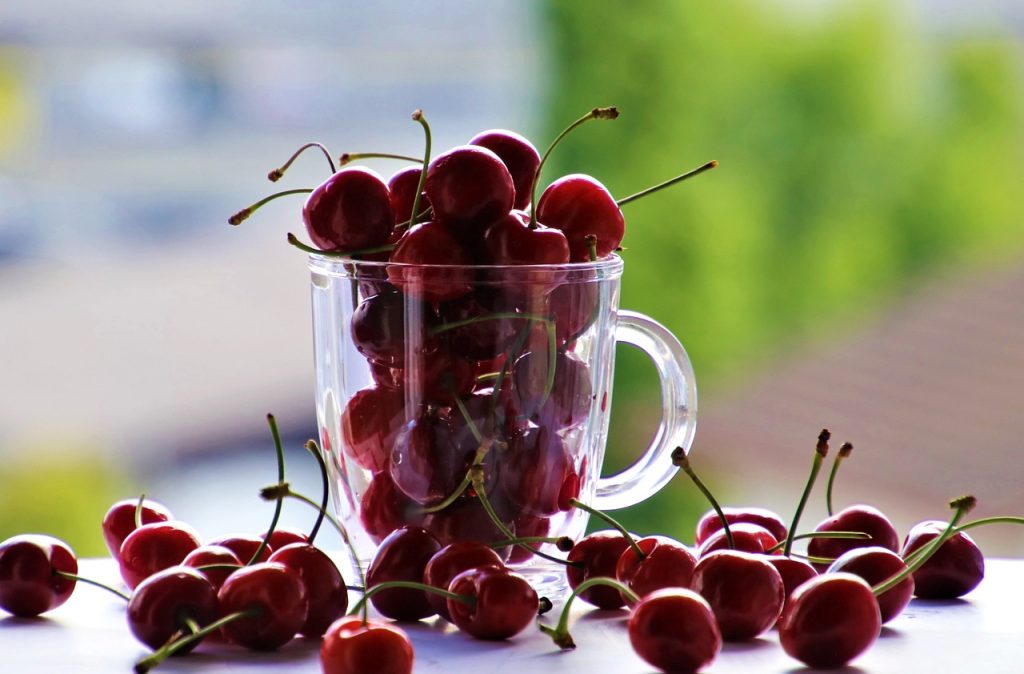 Juicy cherry inside transparent glass – high-resolution image for healthy eating, beverages, or summer fruit theme
